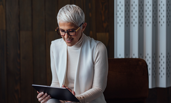 An image of a woman on an iPad